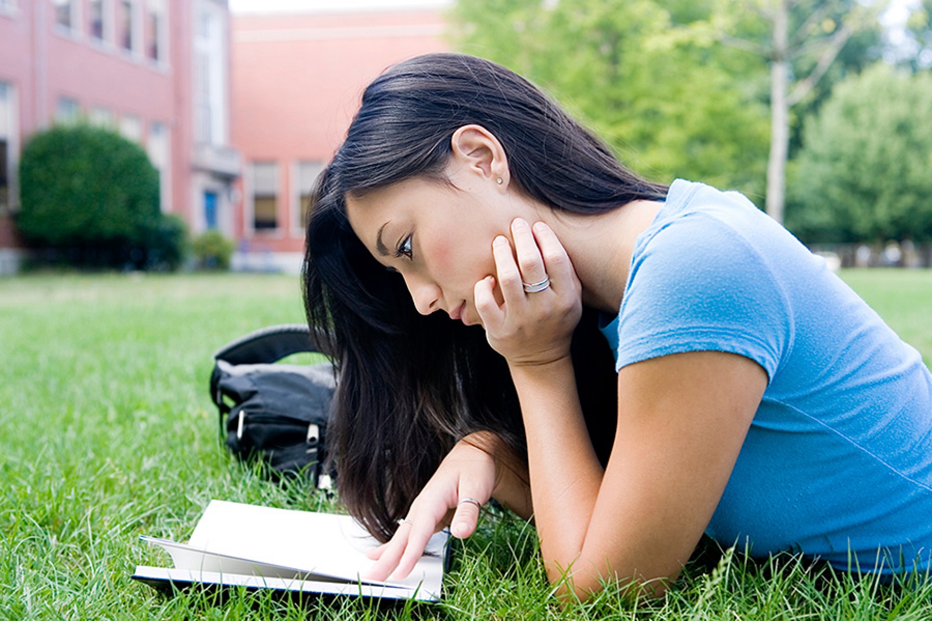 Girl engrossed in book. 