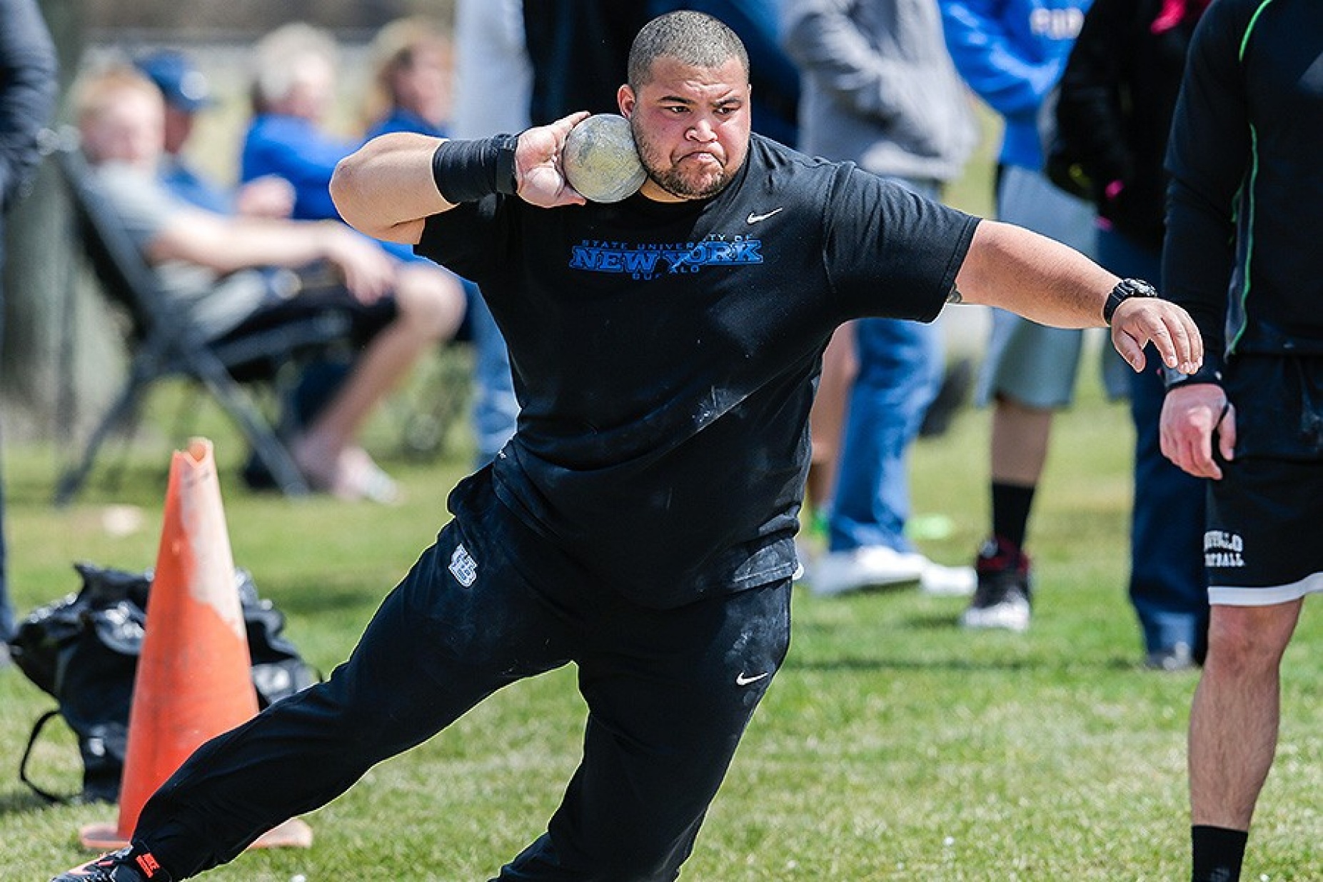 Jonathan Jones throwing shot put. 