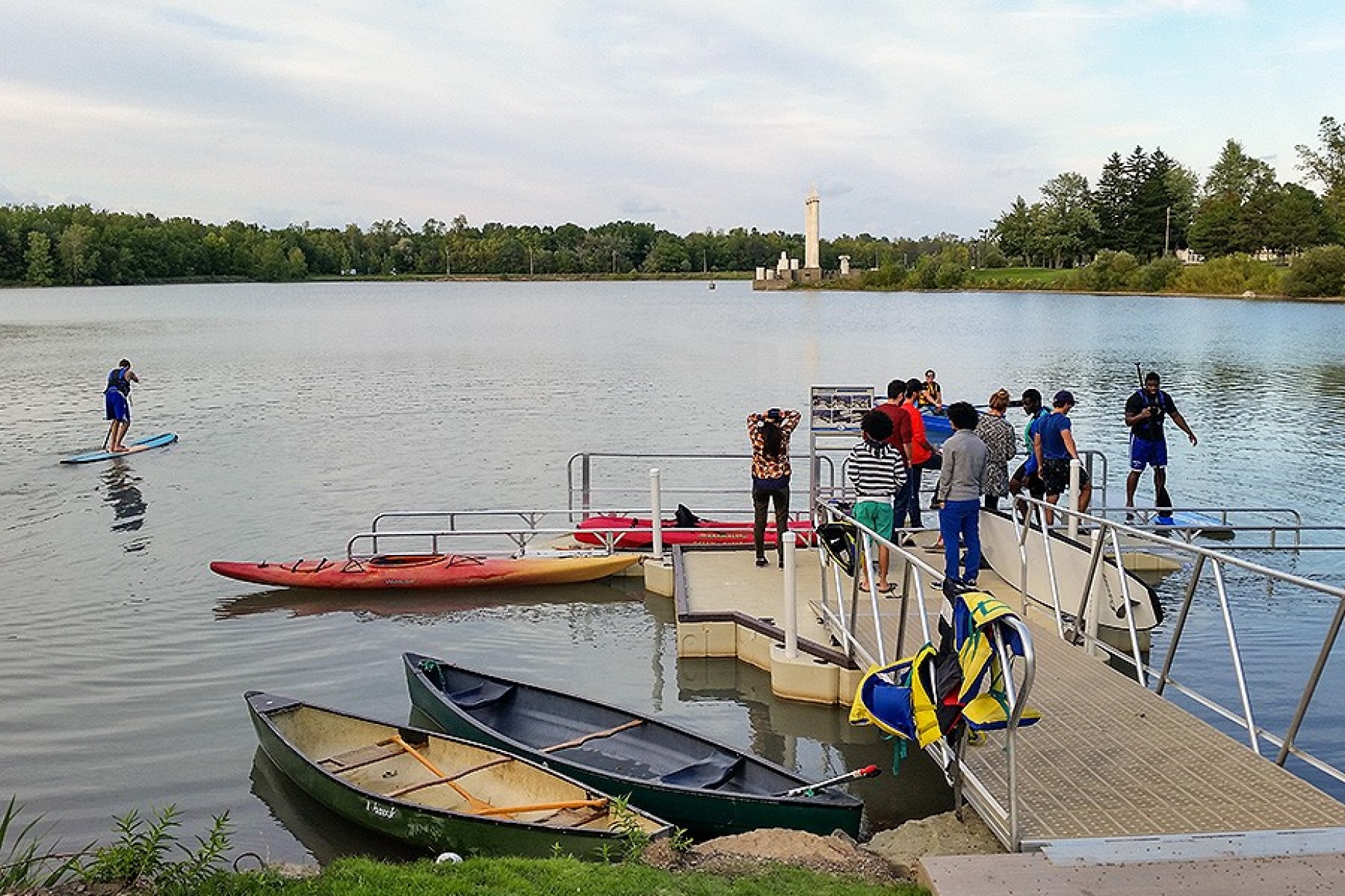 Lake LaSalle boat launch, with paddleboarder. 