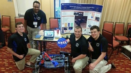 Zoom image: Members of the Space Bulls, and the rover, in Houston. 
