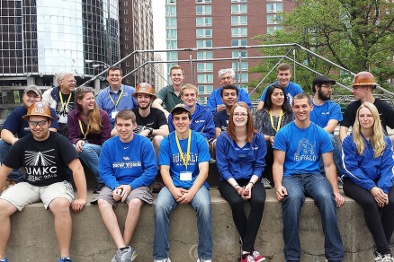 Zoom image: Members of the UB steel bridge team pose for a photo at the competition in Kansas City. Front row, from left: Greg Congdon, Devin Bush, Duncan McAuley, Caitlin O&rsquo;Leary, Mitchell Hares, Lindsay DeVito. Second row, from left: Zeb Hoffmann, Taylor Marrs, Sean Terry, Wil Nagengast, Rushil Verma, Kim Bashualdo, Mark Hare, Ryan O&rsquo;Malley. Third row, from left: John Gast, Todd Snyder, Ed Almeter, Larry Mathews, Andrei Shatalov. Not pictured: Christopher Etienne, Neil Ferguson, Greg Phattanachitchon and Josh Schmid. 
