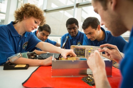 Zoom image: Dozens of students are helping to design and build the microsatellites, which are expected to launch into space in 2017 and 2018. Photo: Douglas Levere 