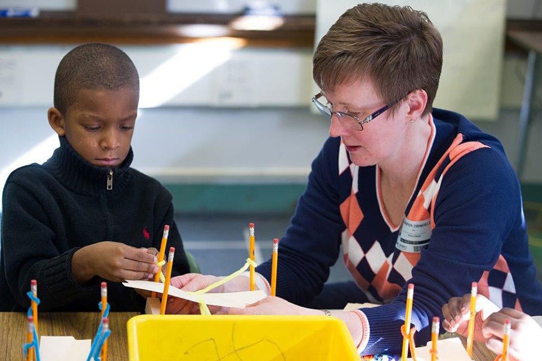 Jennifer Zirnheld, associate professor of electrical engineering, works with a student from Westminster Community Charter School. 