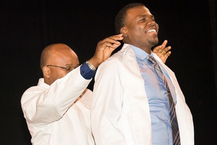 Zoom image: Joseph Iluore is happy to receive his white coat. Photo: Sandra Kicman 