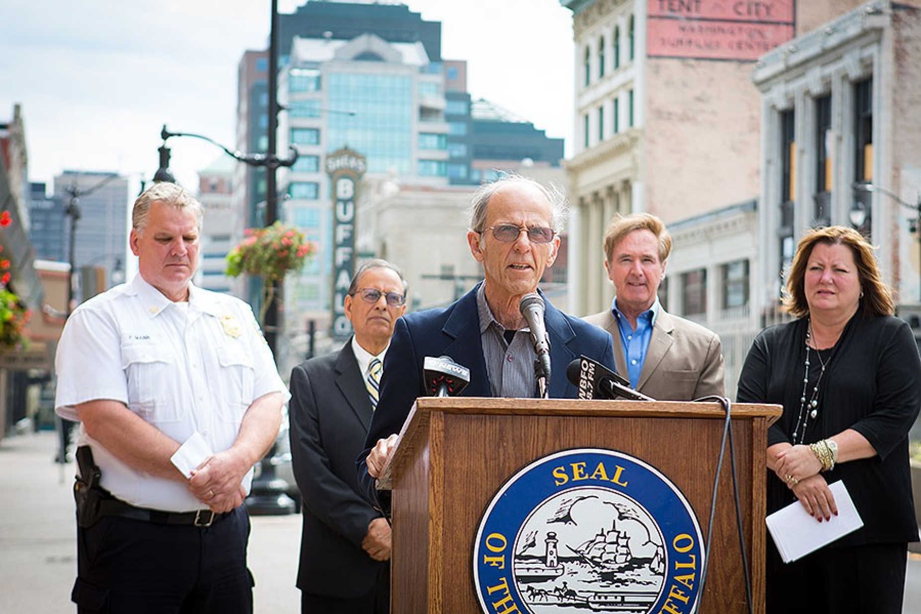 John Violanti speaking at news conference.