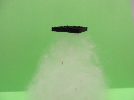 Zoom image: Graphene is incredibly light, so it has no problem resting on top of this cotton-like material. Photo: University at Buffalo. 