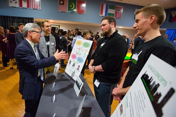 Zoom image: From left: Provost Charles Zukoski talks with LaSalle Concepts reps Philip Schneider, Nicholas Eadie and David Schneggenburrger. Photo: Douglas Levere 