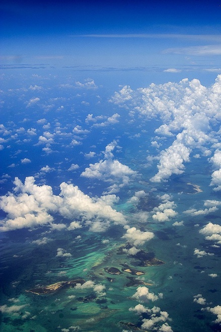 Zoom image: Clouds over small Caribbean islands. Photo: Adam Wilson 