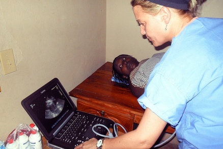 Zoom image: Tammy Bordonaro, an ultrasound technician from Women's and Children's Hospital of Buffalo, performs an ultrasound exam. 