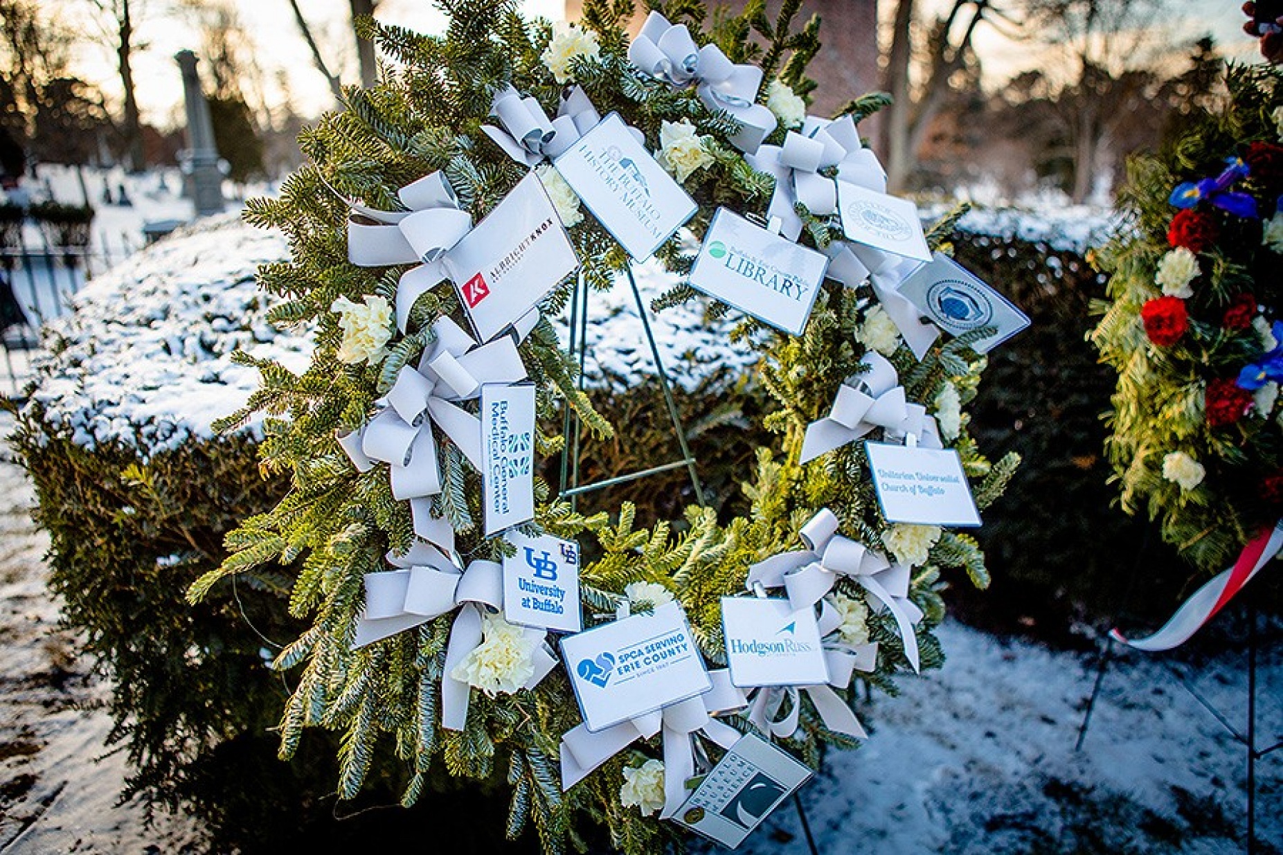 Wreath bearing "legacy organizations'" markers. 