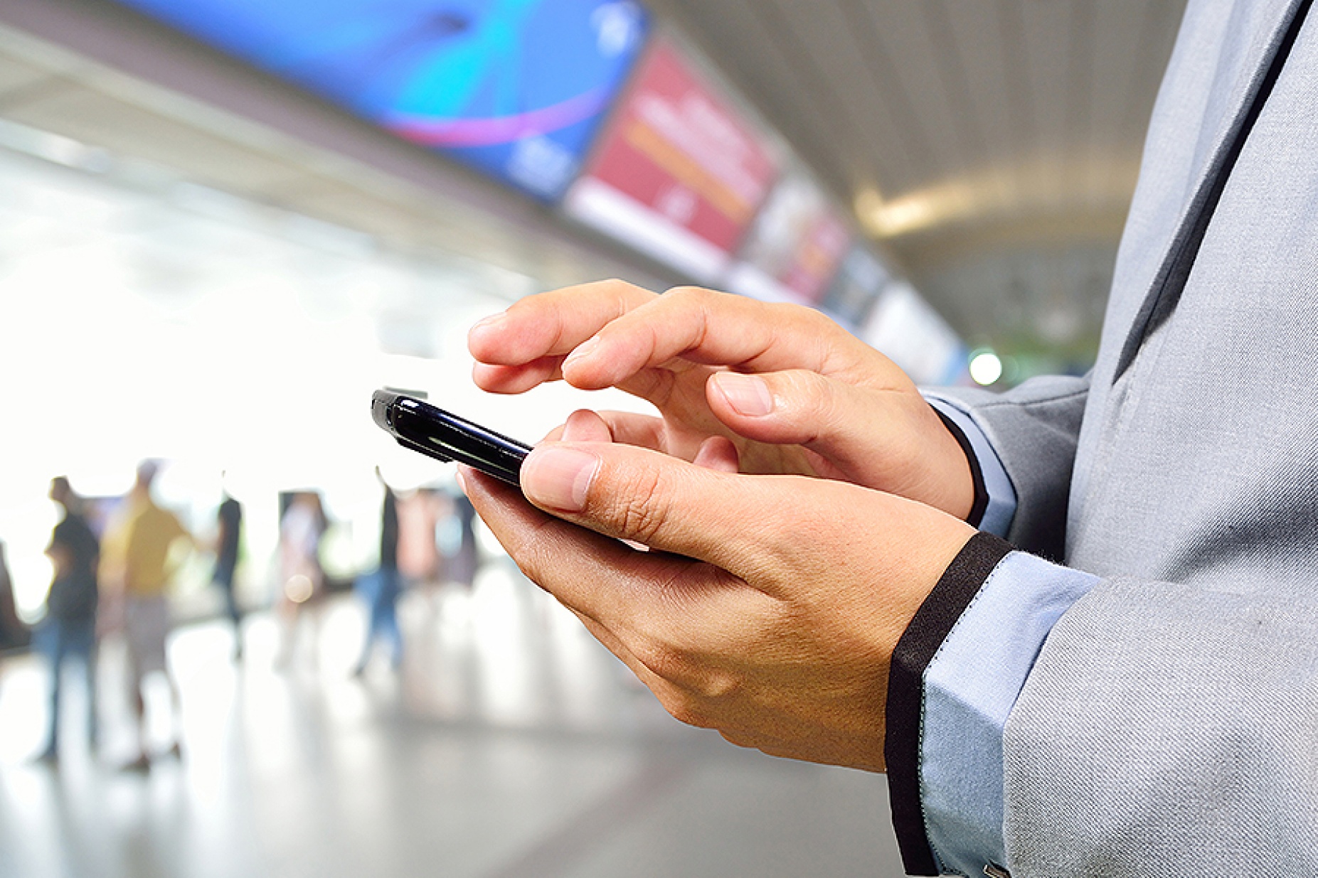 Man using cellphone in the subway. 