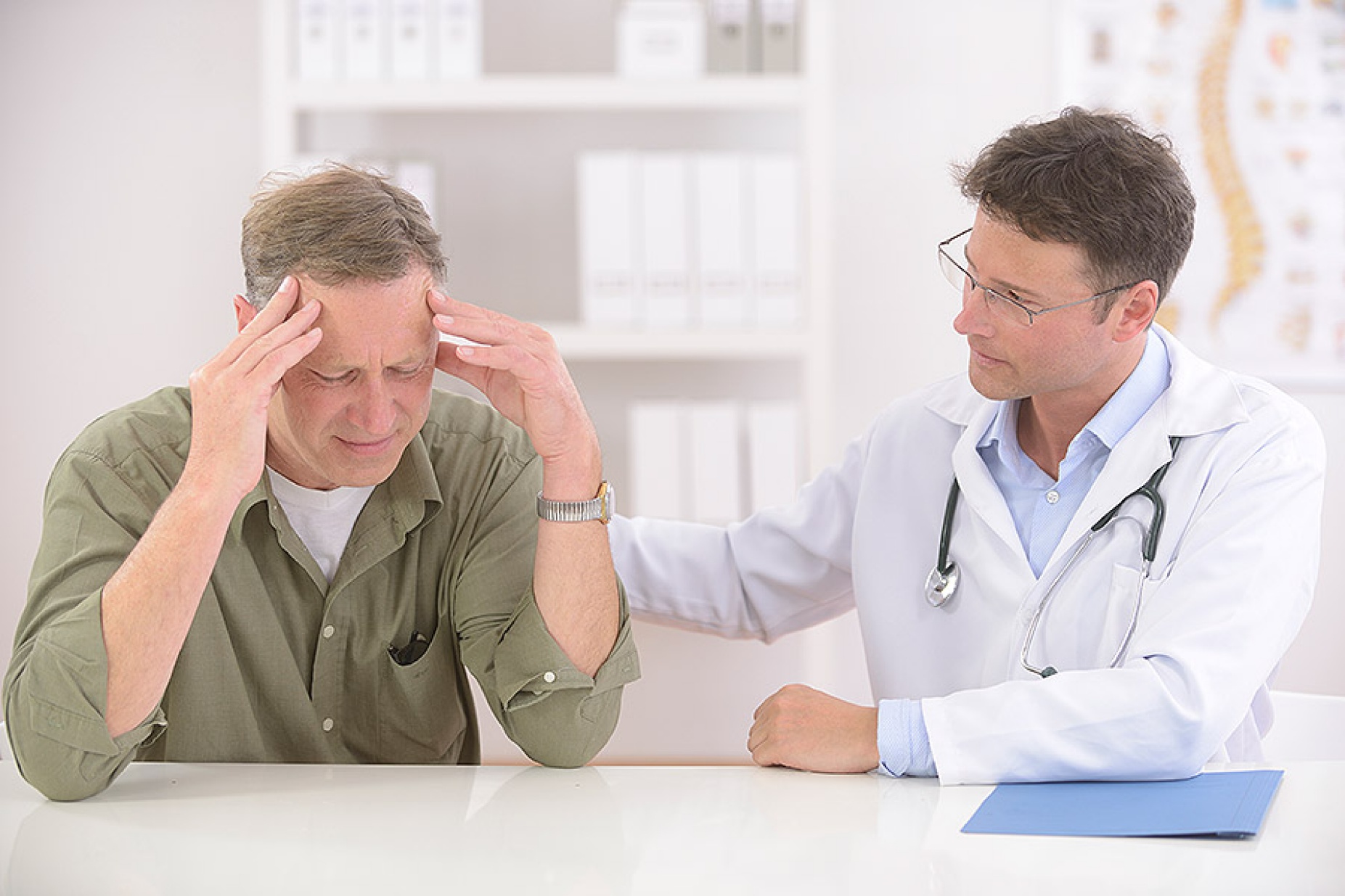 Anxious male patient with doctor. 