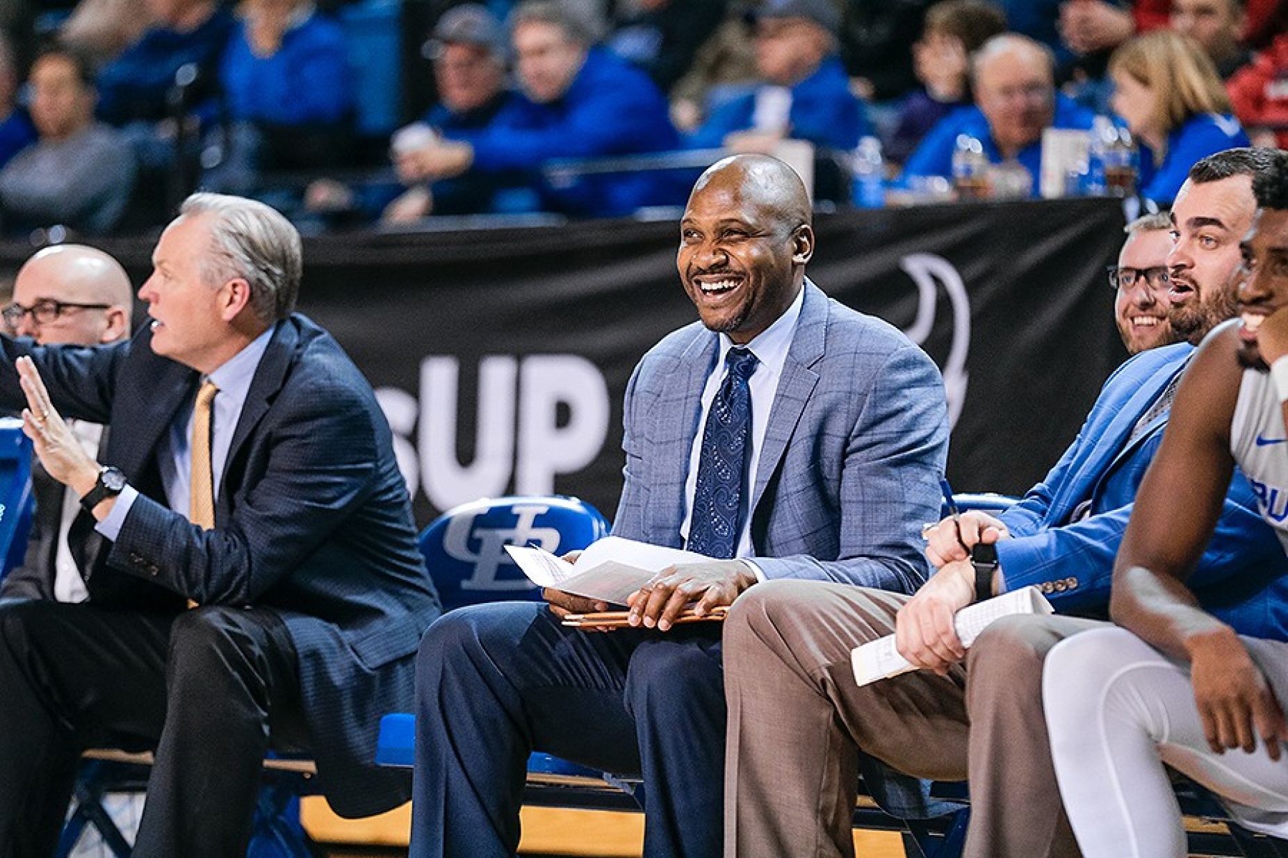 Lindsey Hunter on the bench during a baskeball game. 