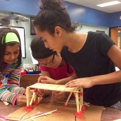 girls working together on a STEM project. 
