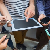 Students using tablet pc and their smartphones. 