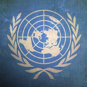 UN logo on a textured blue background. 