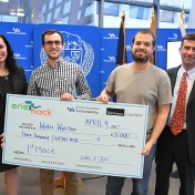 First-place team with their "check". 