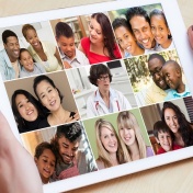conceptual photo of a doctor teleconferencing with several families on an ipod. 