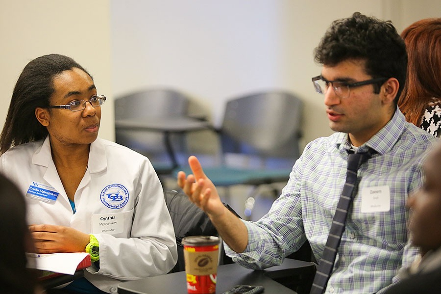 Two students, Cynthia Mgbeojirikwe and Zaeem Shah, participate in the Interprofessional Education Forum. 