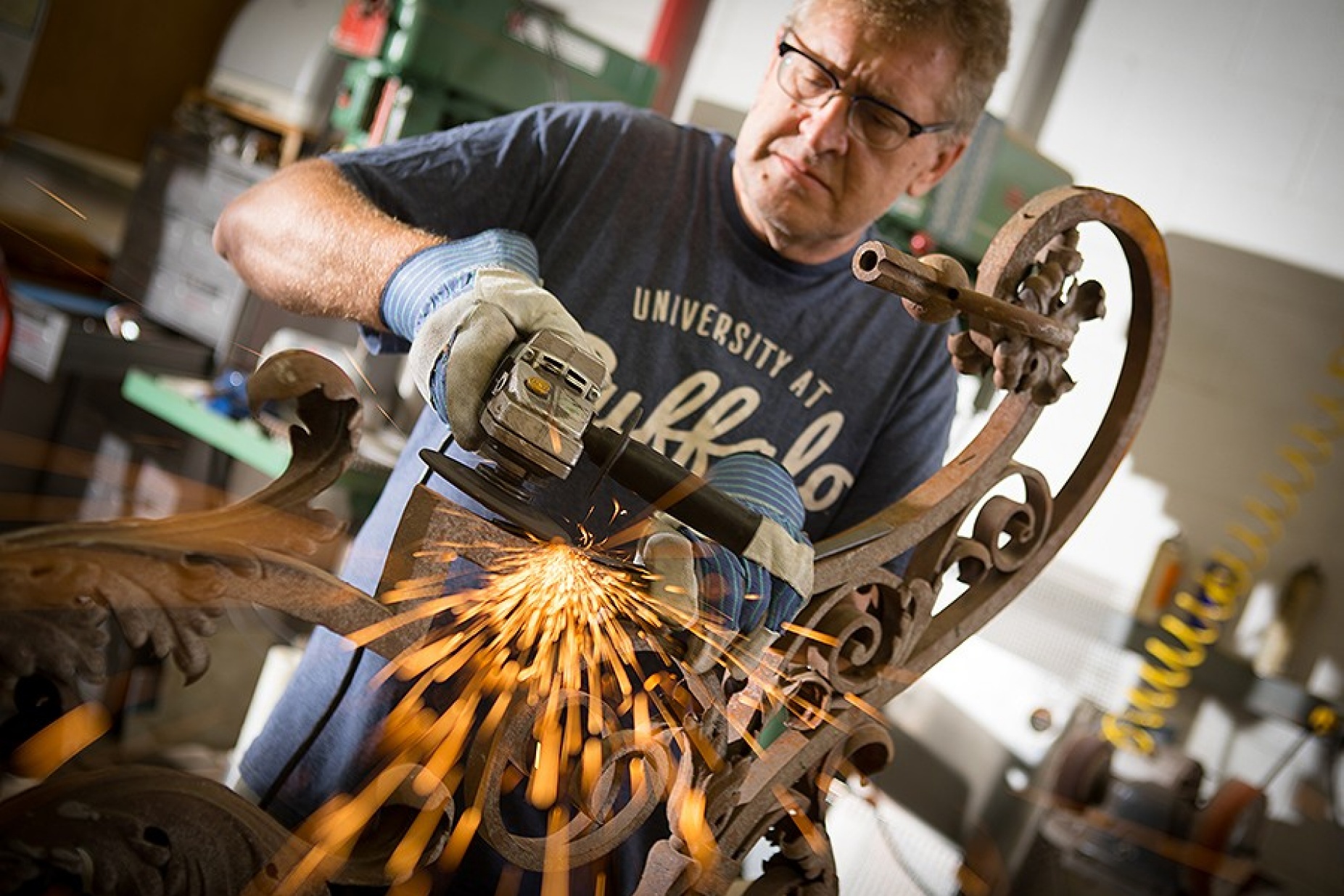 Brian Koyn grinds years of rust off the newly discovered lantern. 