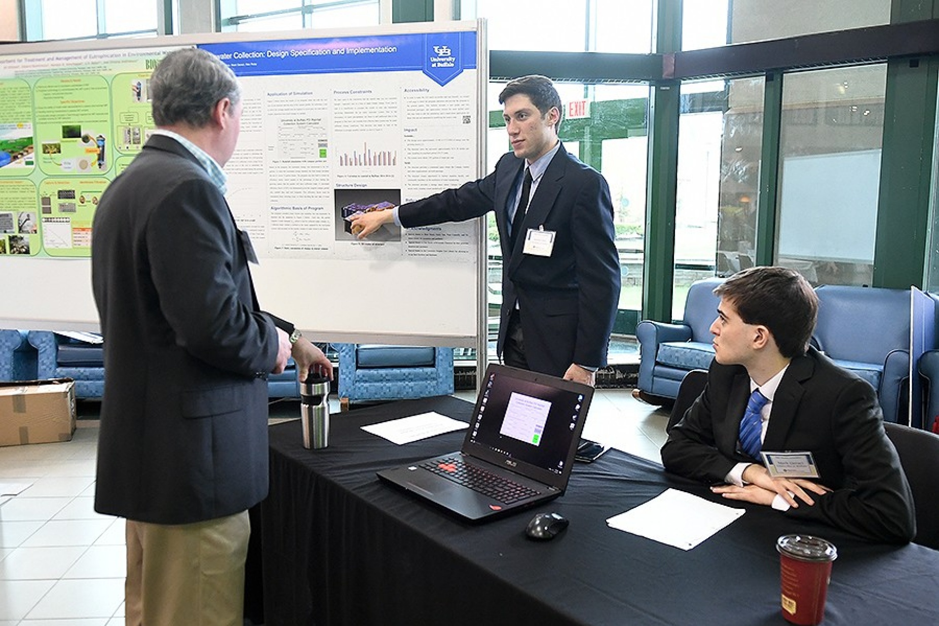 UB undergraduate students Mark Geraci and Austin Izzo discuss their project during the sixth annual NYSP2I Research & Development student competition hosted at UB. 