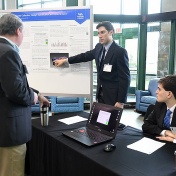 UB undergraduate students Mark Geraci and Austin Izzo discuss their project during the sixth annual NYSP2I Research & Development student competition hosted at UB. 
