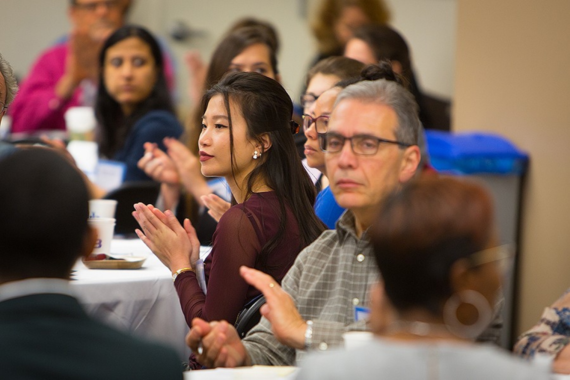 Participants at the summit listen intently. 