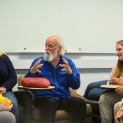 photo of faculty member Peter Horvath surrounded by students during Un-Office Hours. 