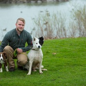 Garrett Cygan poses with his two dogs Rory on the left and Bogey on the right, near Lake LaSalle. 