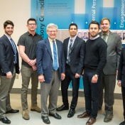 Winners of the Student Entrepreneur Fellowship Competition (eLab) stand with Provost Charles F. Zukoski in the Alfiero Center at the School of Management. 