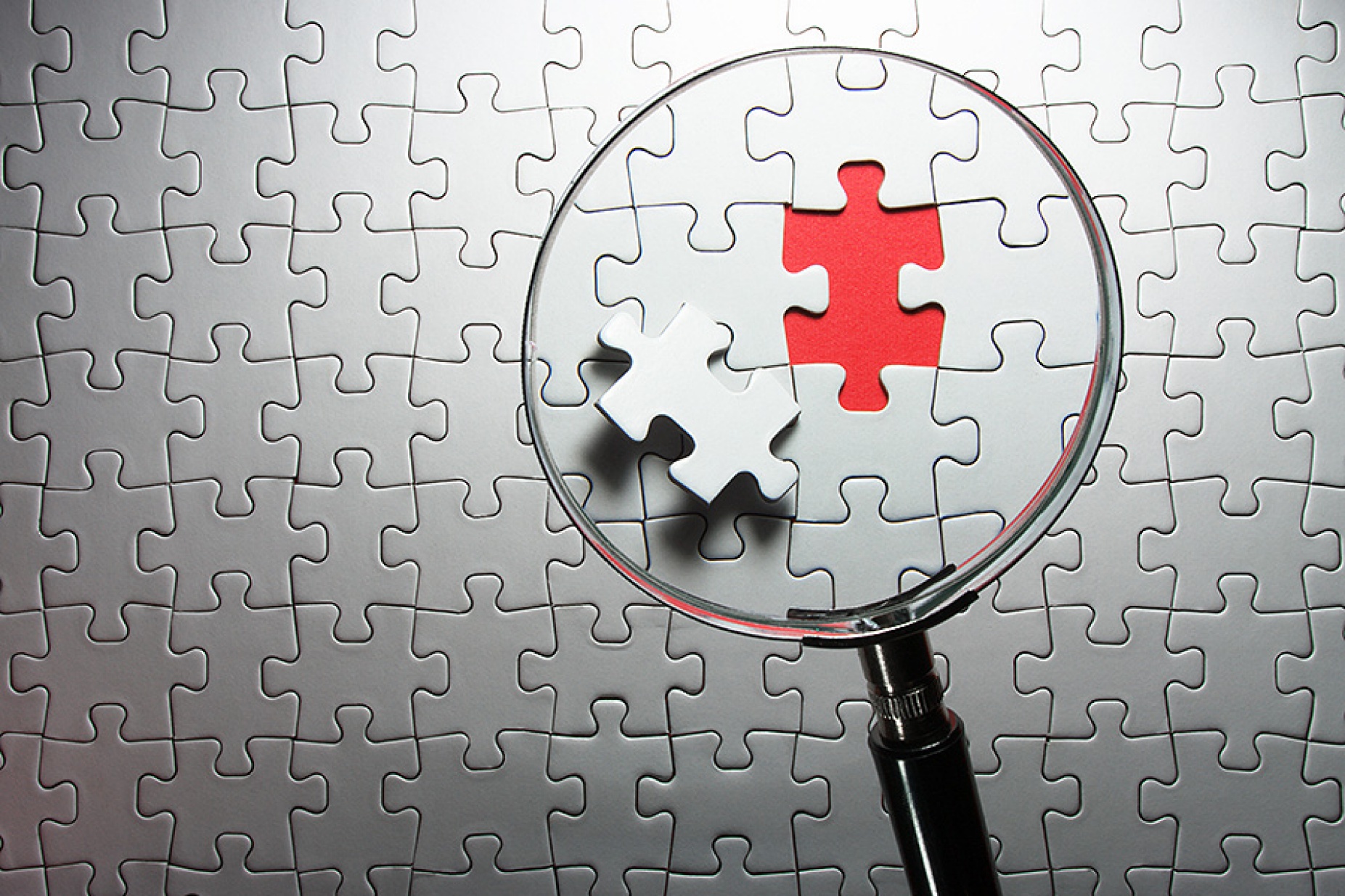 Photograph of a puzzle missing a piece. 