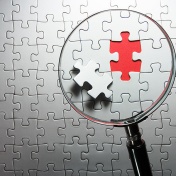 Photograph of a puzzle missing a piece. 