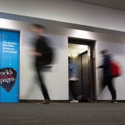 Silverman Library elevator advertising the Rocks Back Pages database. 
