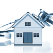 house with a stethoscope pressed onto its roof. 
