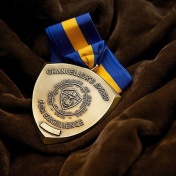 SUNY Chancellor's Award medal. 