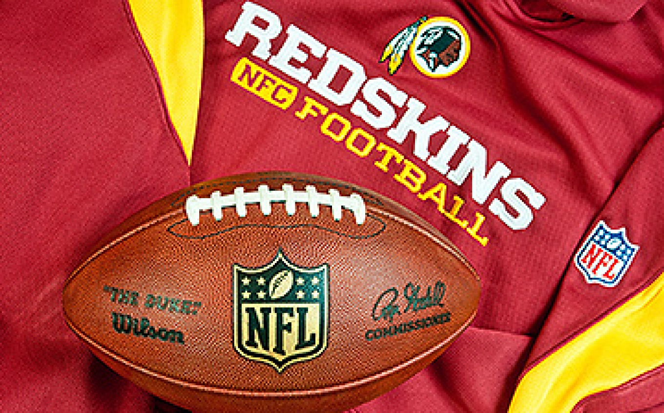 Washington Redskins jersey with the logo and an NFL football. 