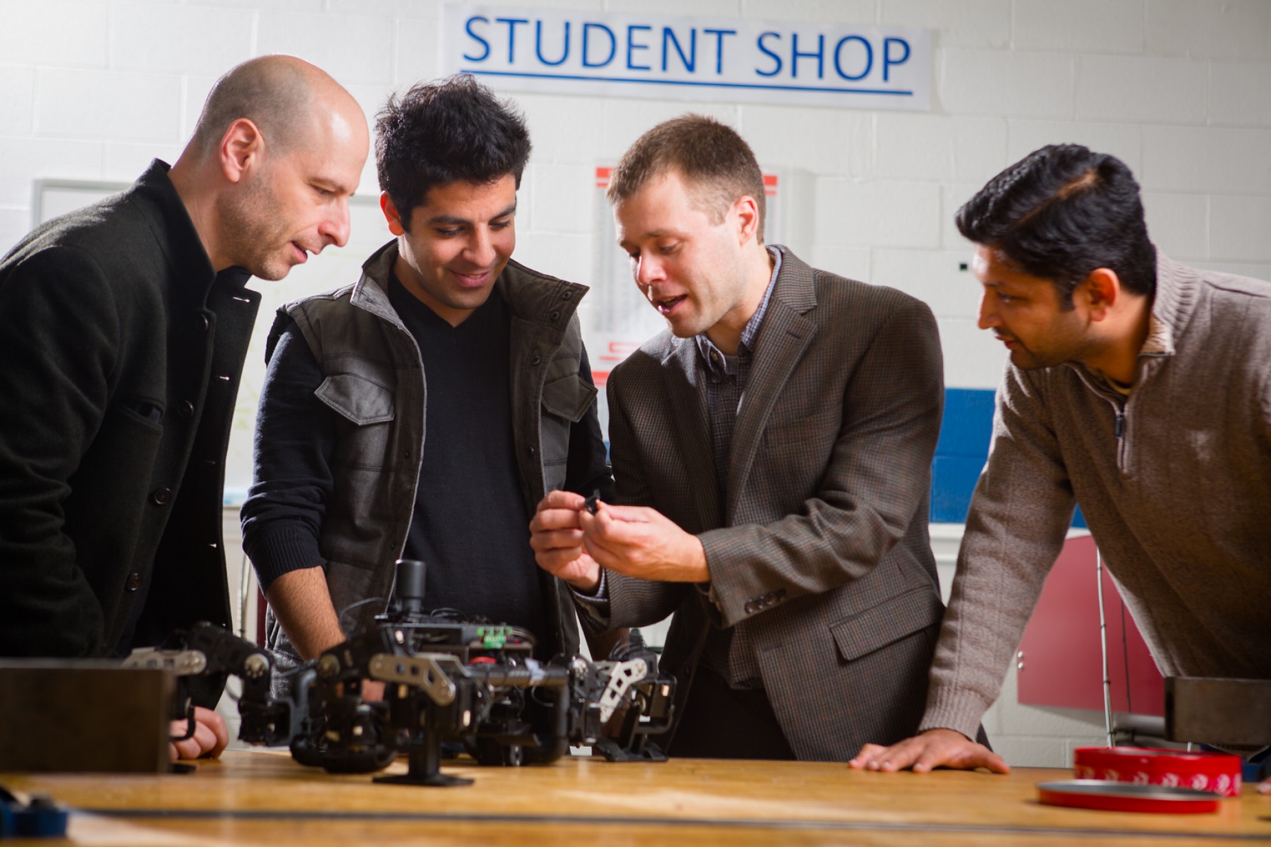 UB faculty working with robotics. 