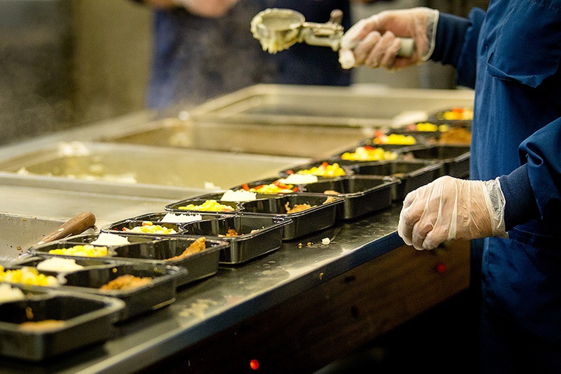 Meals being prepared and packaged for delivery. 