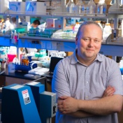 photo of HarkerBio CEO Artem Evdokimov in the lab. 