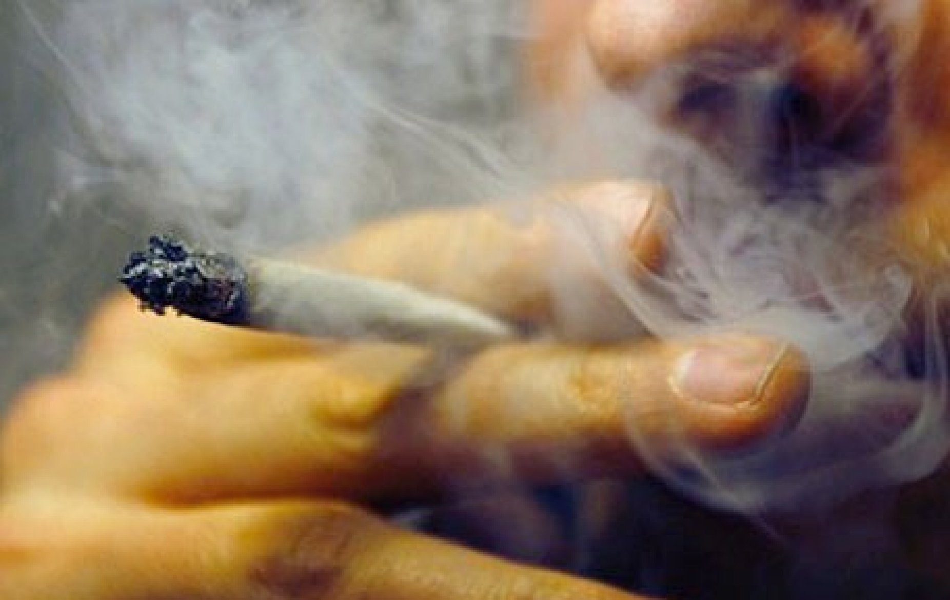 closeup of man smoking marijuana. 