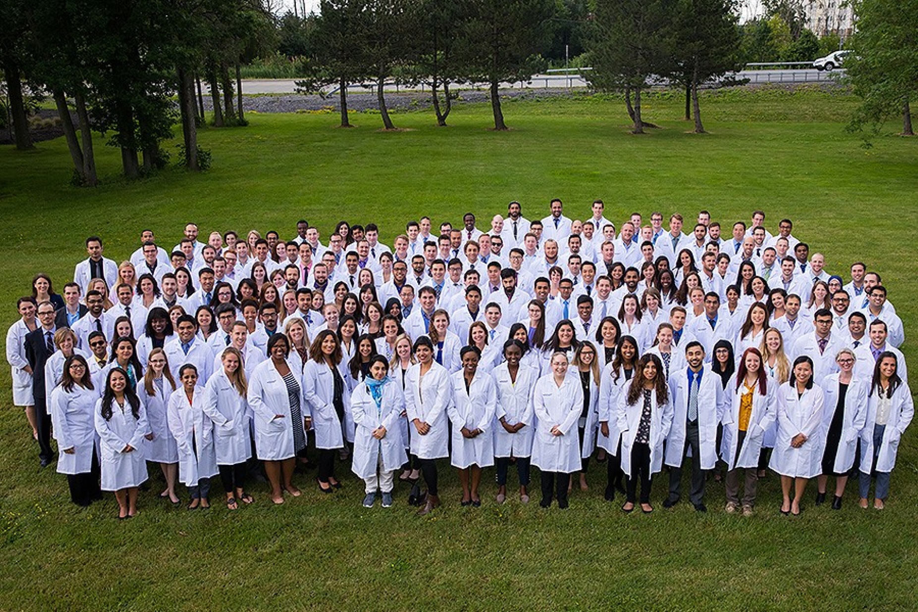 Jacobs School of Medicine and Biological Sciences' long white coat ceremony—new residents group photo. 
