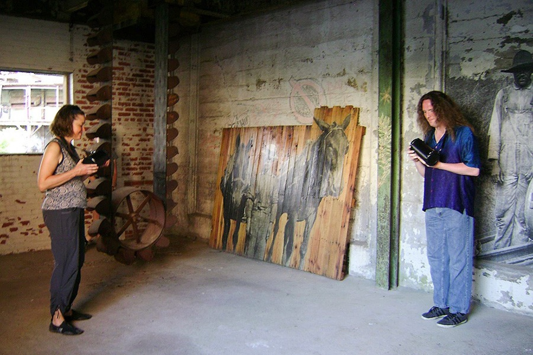 PLACE, part 6: "A 10K Hz squarewave and amplified white noise are to be played separately through two loudspeakers. Two performers are to each hold one of the loudspeakers while slowly walking through the environment." — with Leanne Darling and Zane Merritt at Silo City. 