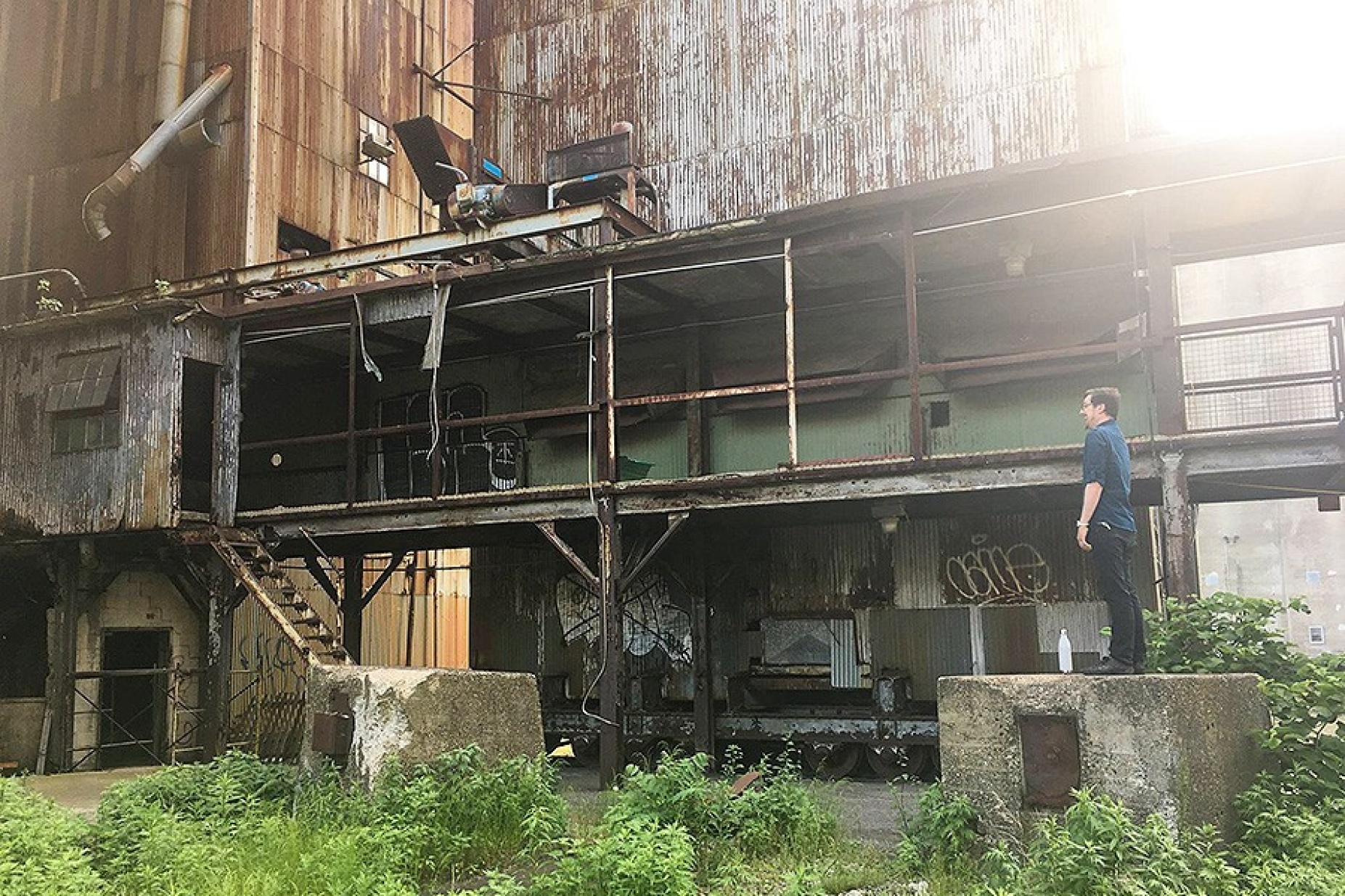 PLACE, part 8: "A group of vocalists are to produce loud non-verbal vocal sounds attempting to trigger resonances in the environment. All vocalists are to be spatially separated over a large distance within audible range of each other." — at Silo City. 