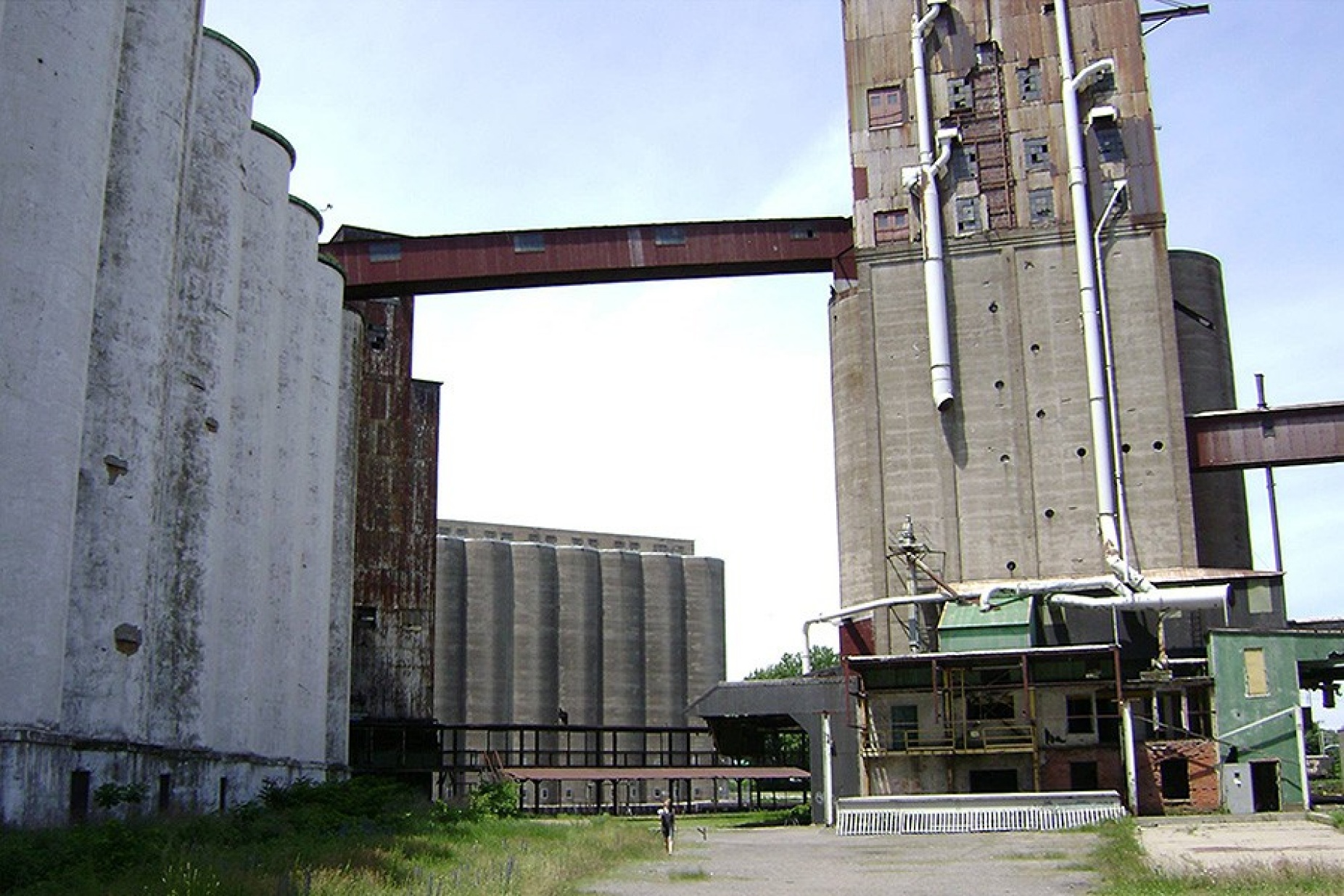 PLACE, part 1: "Utilize a single microphone to record the ambient sounds of the environment. Walk slowly from a central point in space, while holding the microphone, moving outward in enlarging circle motions away from the central point so as to be moving in a spiral. 