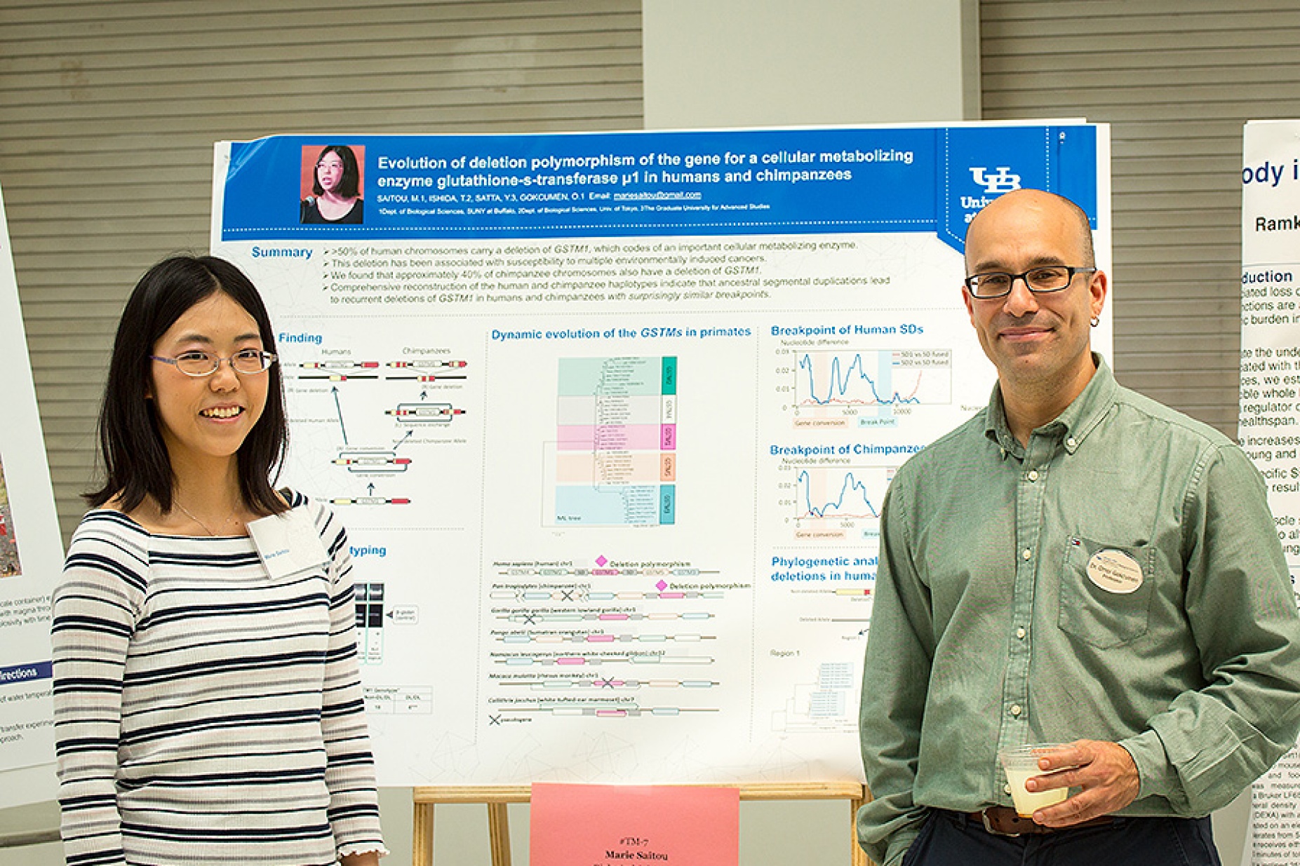 Postdoc Marie Saitou and her mentor, Omer Gokcumen, at Saitou's poster presentation in the Center for the Arts Atrium. 