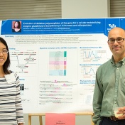 Postdoc Marie Saitou and her mentor, Omer Gokcumen, at Saitou's poster presentation in the Center for the Arts Atrium. 