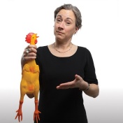 Caroline Funk holding a rubber chicken. 
