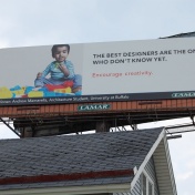 Andrew Mamarella's billboard: picture of a toddler and the words: The best designers are the ones who don't know yet. Encourage creativity. 