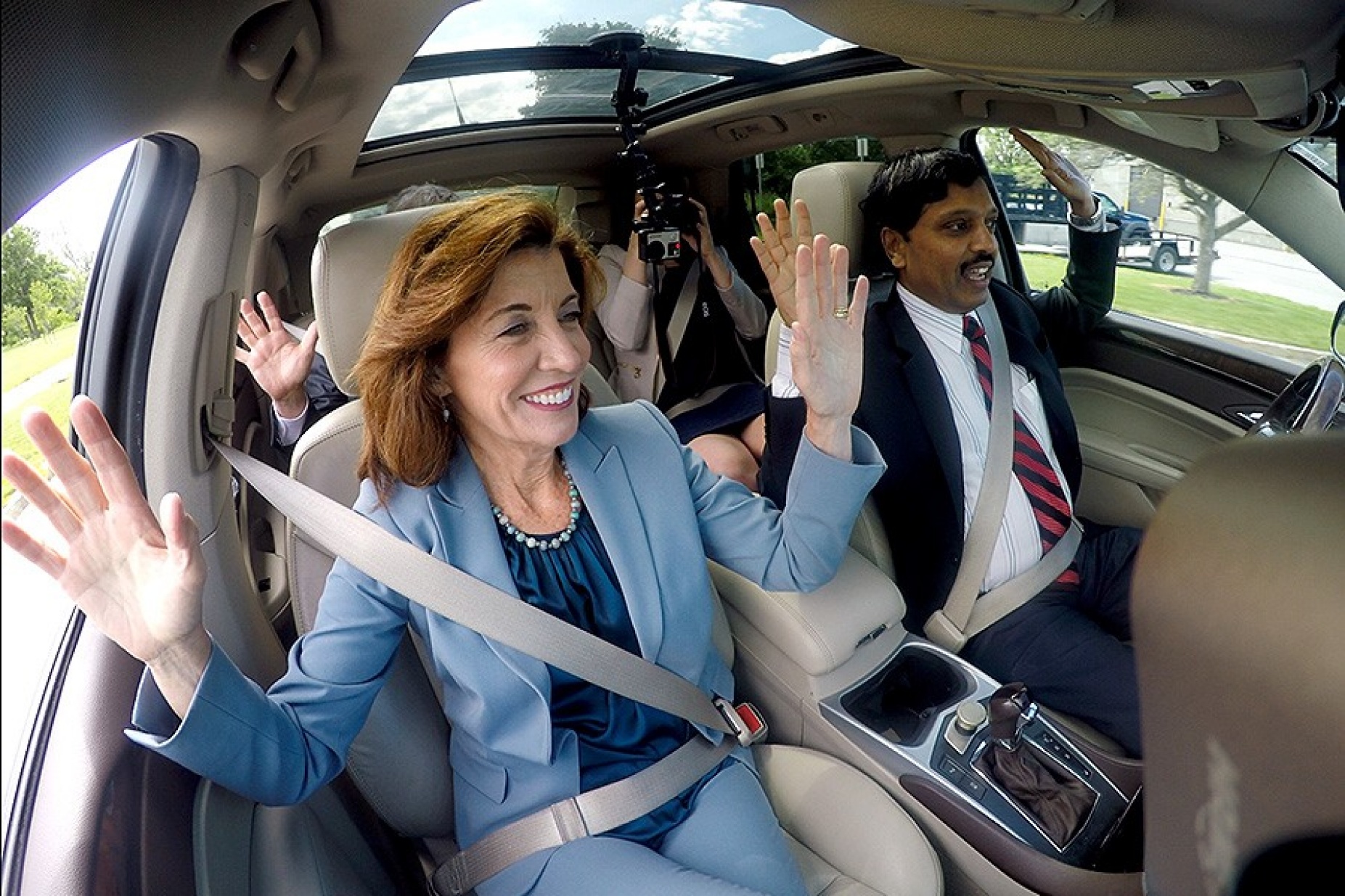 Lieutenant Governor Kathy Hochul (left) and Prof. Ragunathan "Raj" Rajkumar, of Carnegie Mellon University, ride in the driver-less Cadillac SUV developed by Carnegie Mellon University (CMU) on UB's North Campus on June 20, 2017. Photo: Meredith Forrest Kulwicki. 