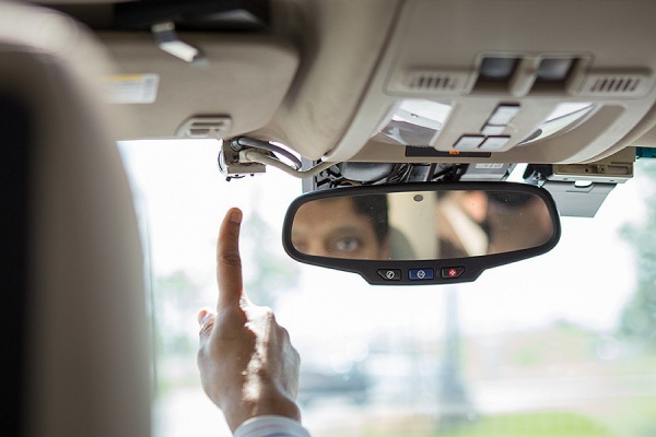 Zoom image: Ragunathan "Raj" Rajkumar of Carnegie Mellon University points out the sensor that recognizes traffic conditions, such as stop signs and speed limits. 